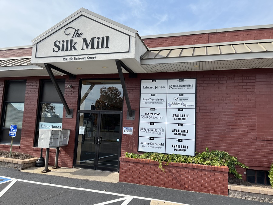 parking lot view of the silk mill building directory